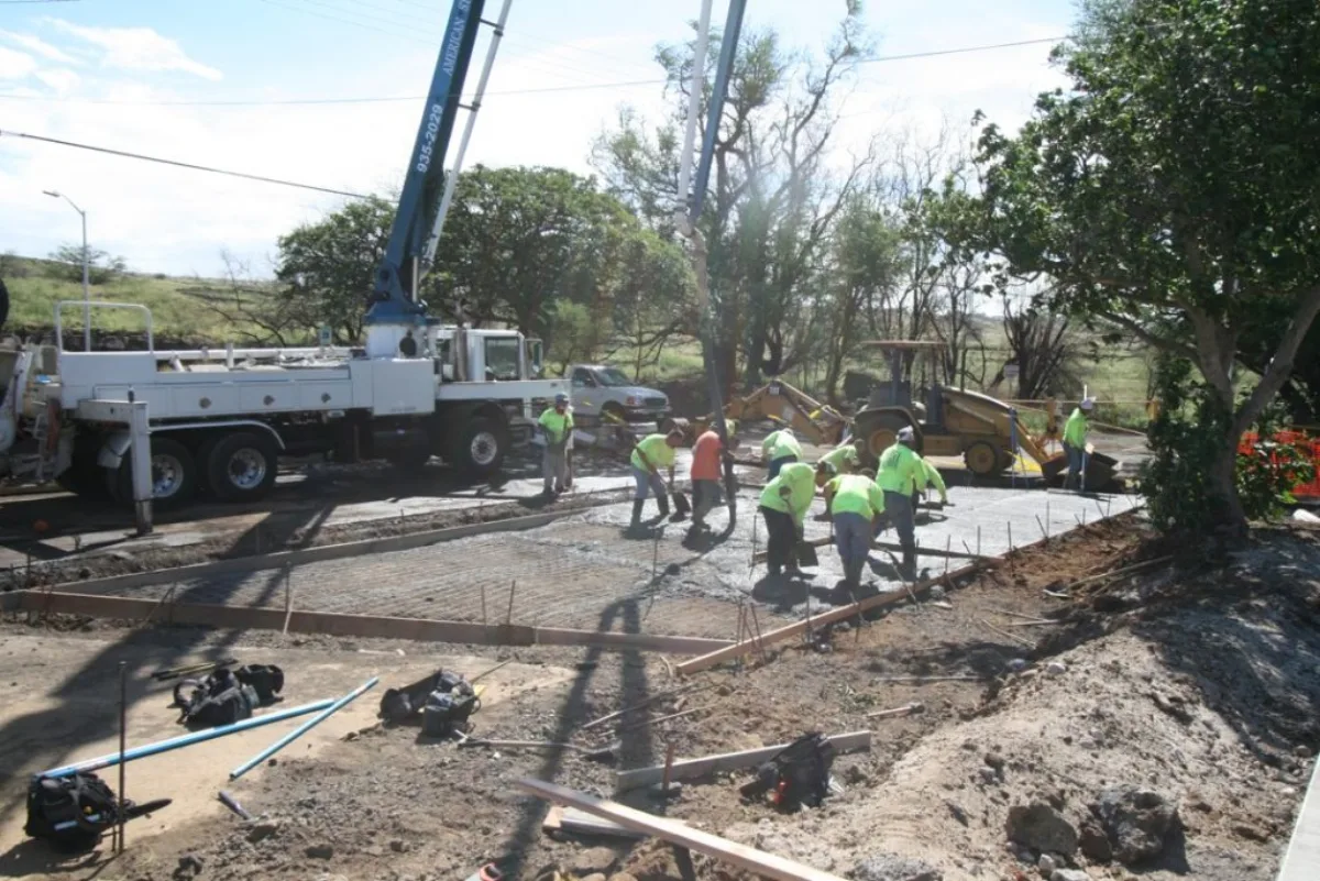 A MIRA crew in high-visibility gear forming and placing work on a jobsite.