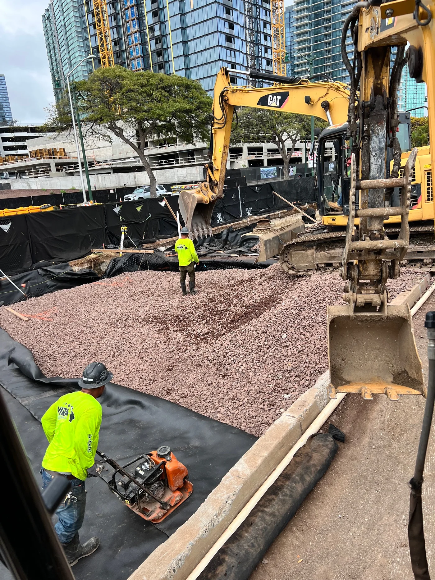 Civil excavation and grading work in Honolulu's urban corridor.