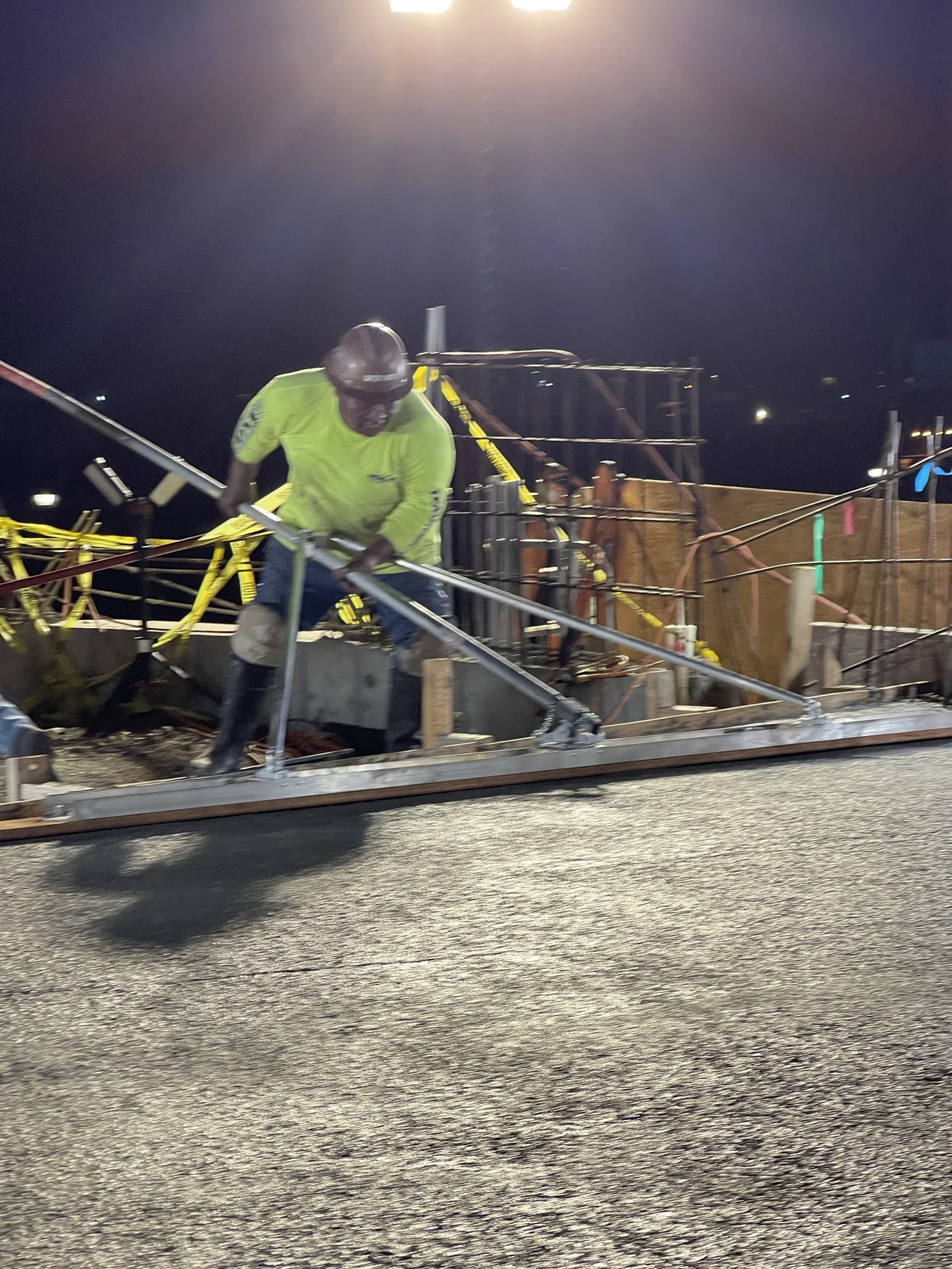 MIRA field crew placing concrete during elevated walkway construction.