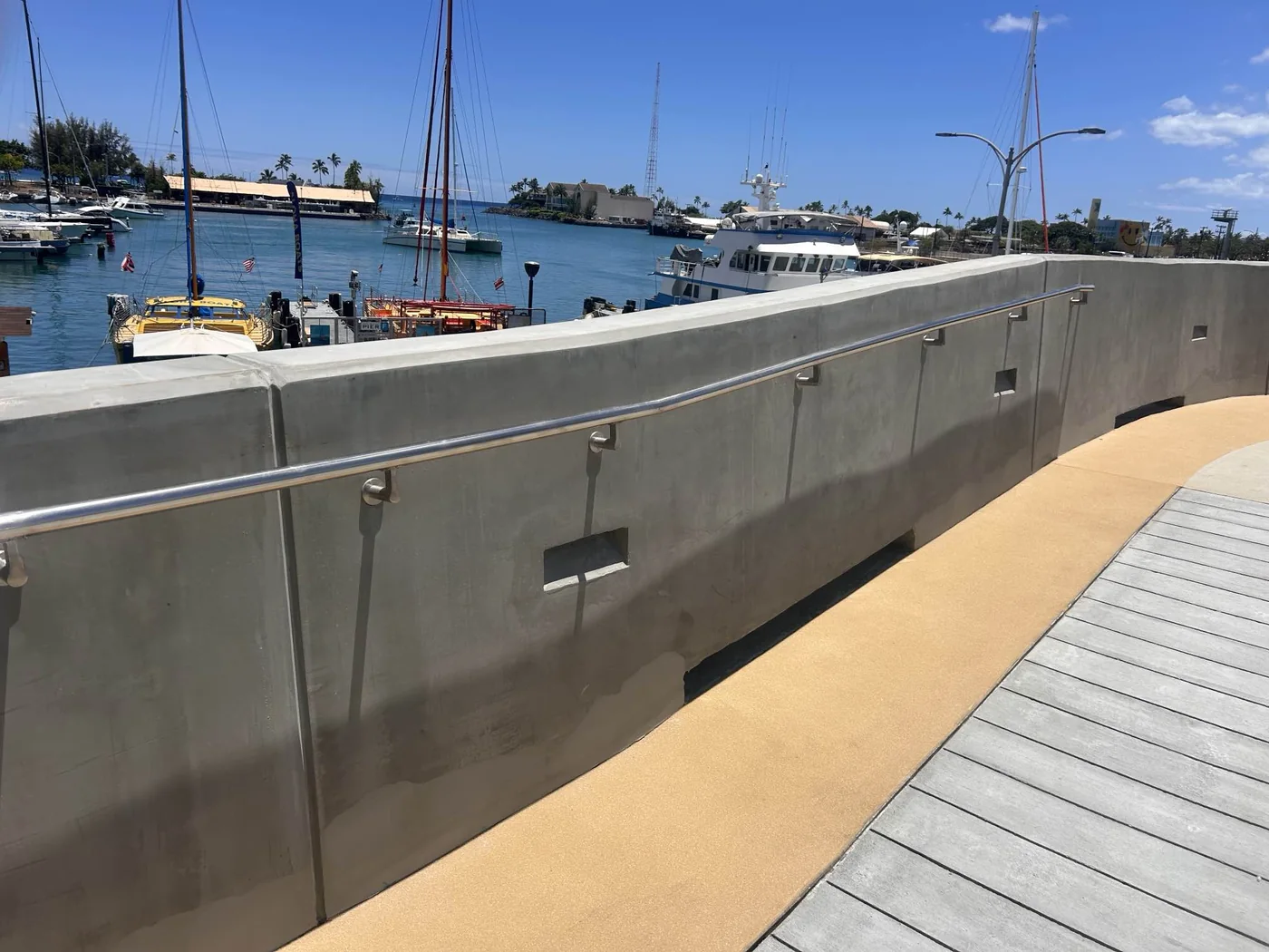 MIRA crew completing final finish work along the elevated walkway.