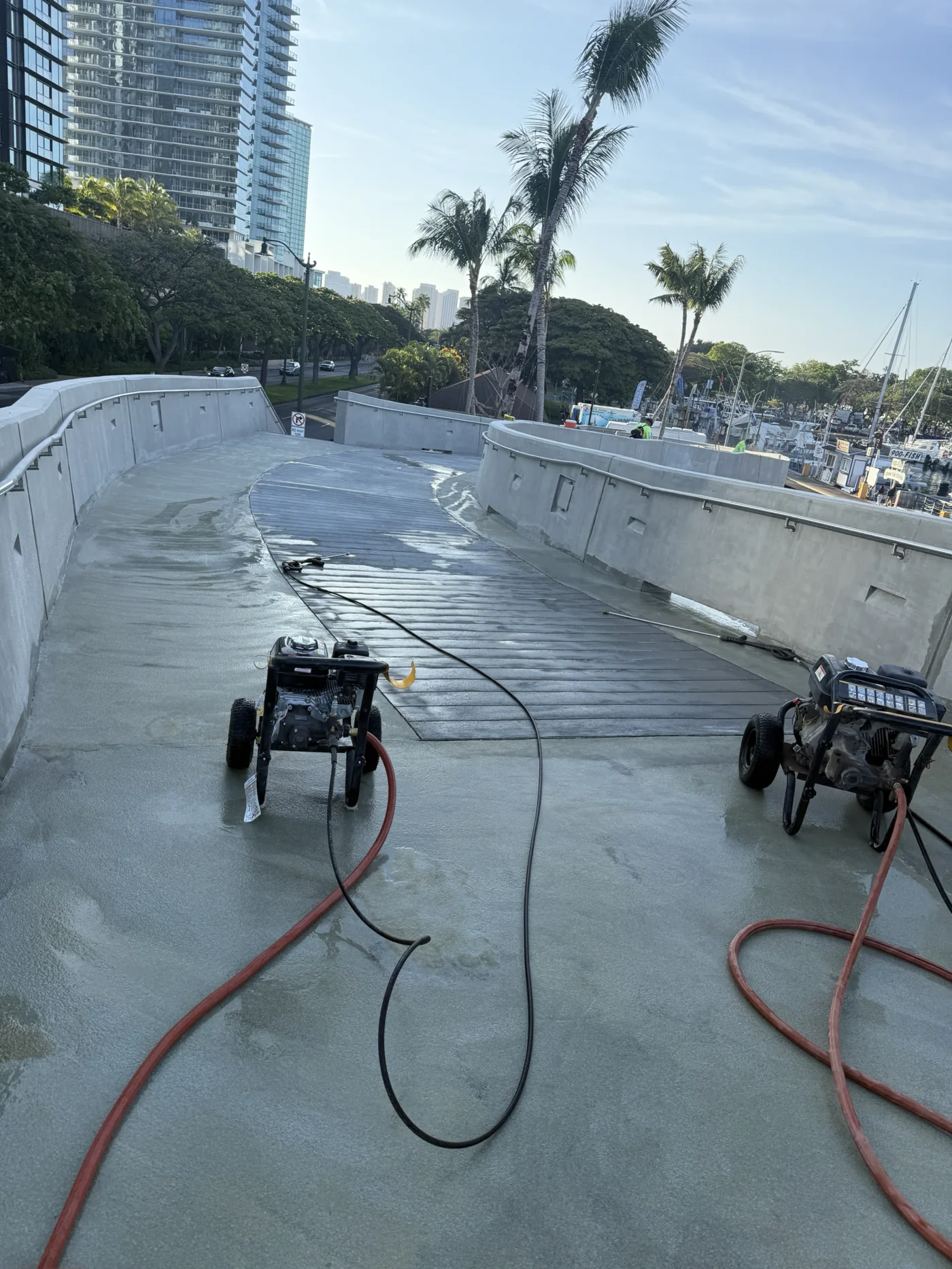 Near-complete pedestrian walkway and landscape-edge construction.