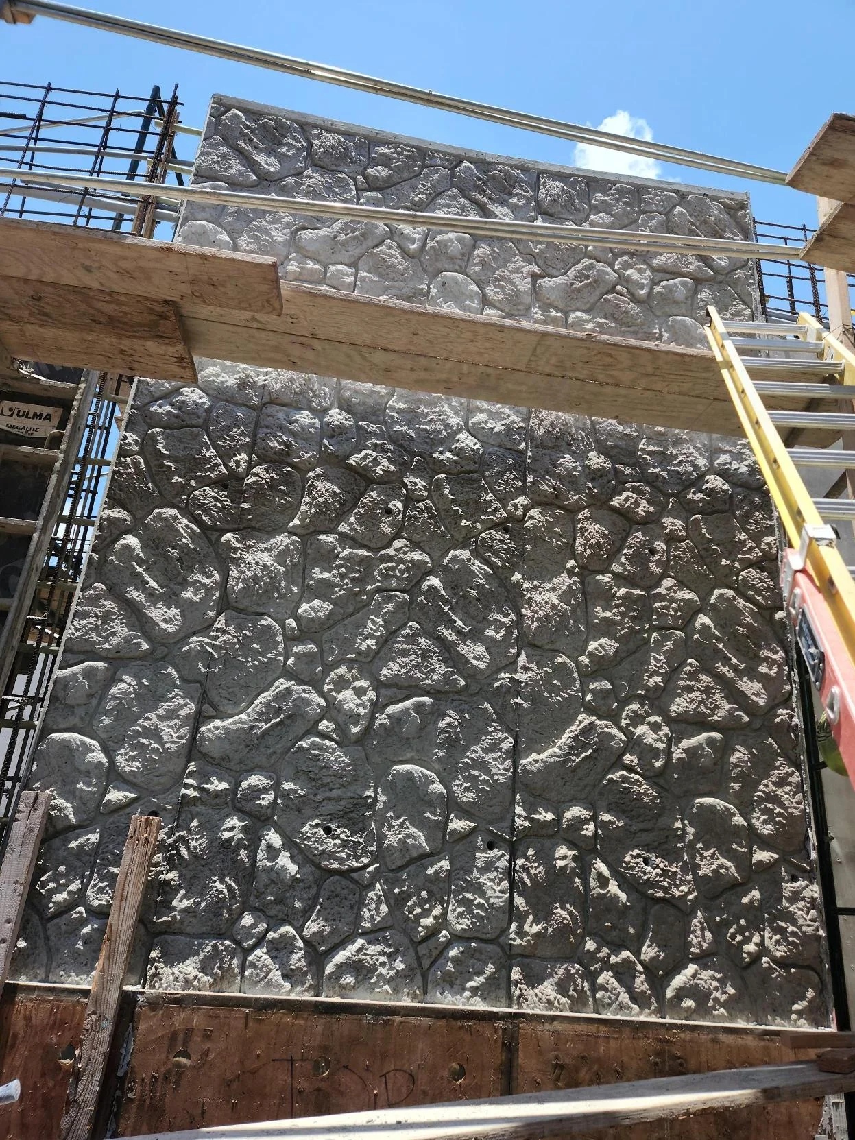 Textured concrete formwork installed at the pedestrian walkway site.