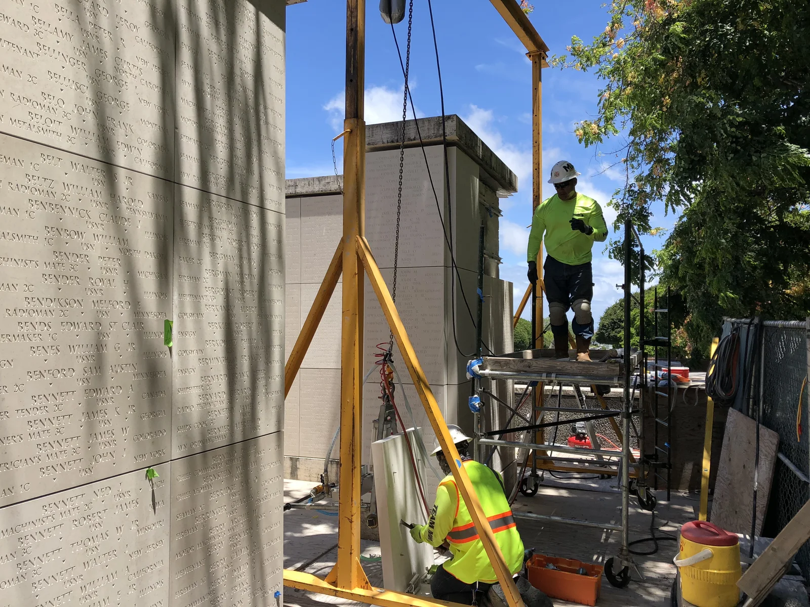 MIRA crew working from access platforms at the memorial wall.
