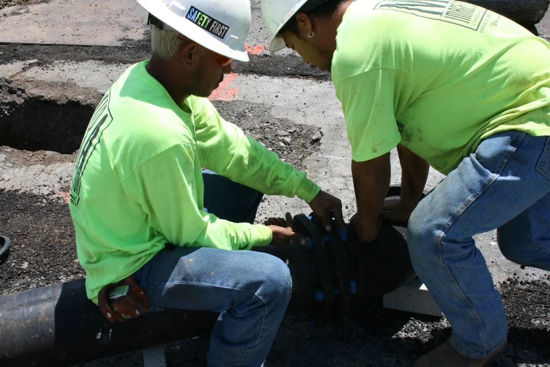 Trench work and traffic coordination in the Kapahulu neighborhood.