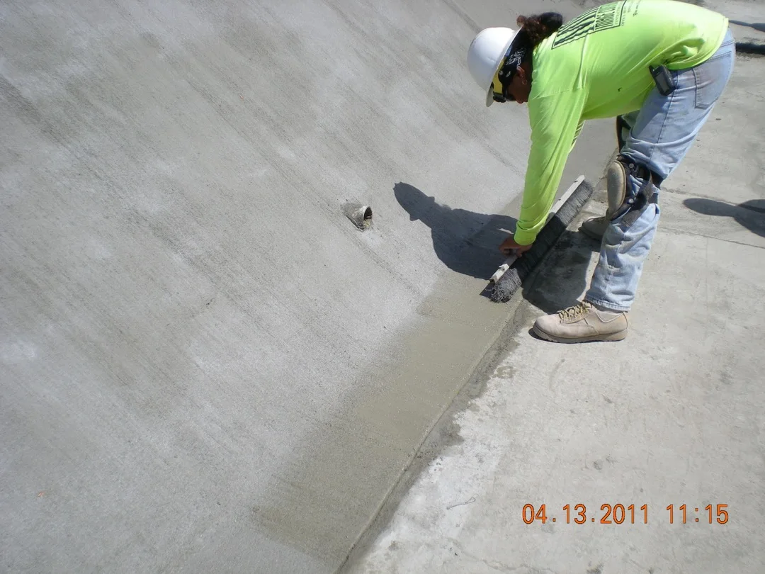 MIRA crew finishing a restored concrete channel surface.