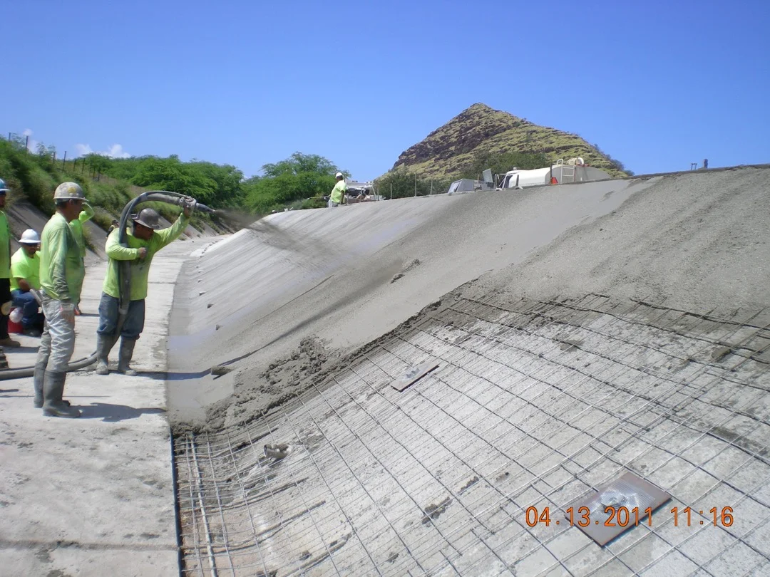 Channel-restoration crew completing a concrete placement.