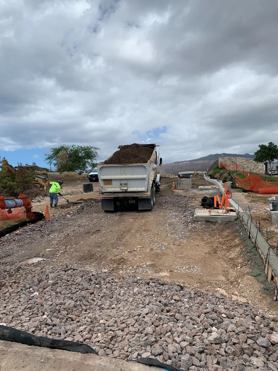 MIRA crew preparing a graded industrial-site section for the next phase.