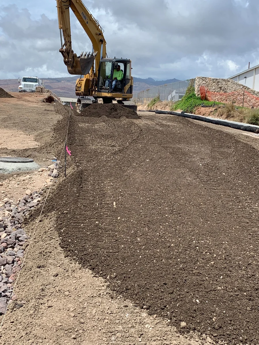 Aggregate placement and grading at Malakole Industrial Park.