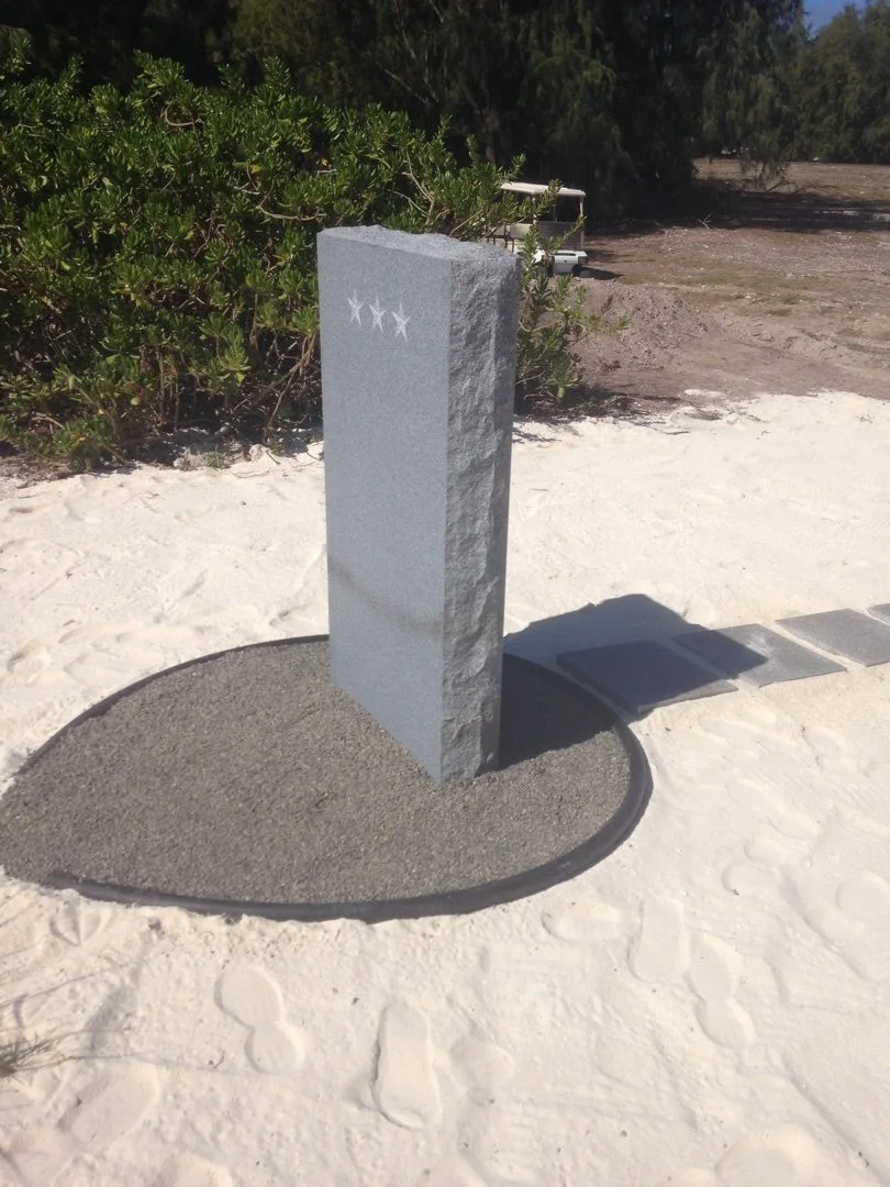 Completed Battle of Midway Memorial monument on the shoreline.