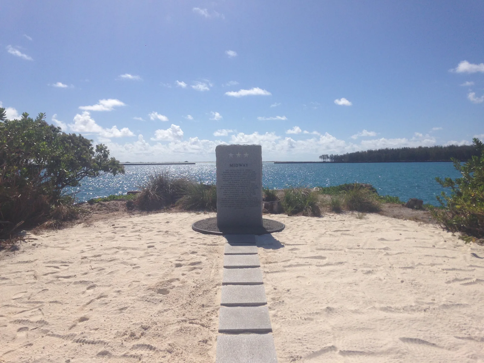 The Midway memorial set within the island landscape.