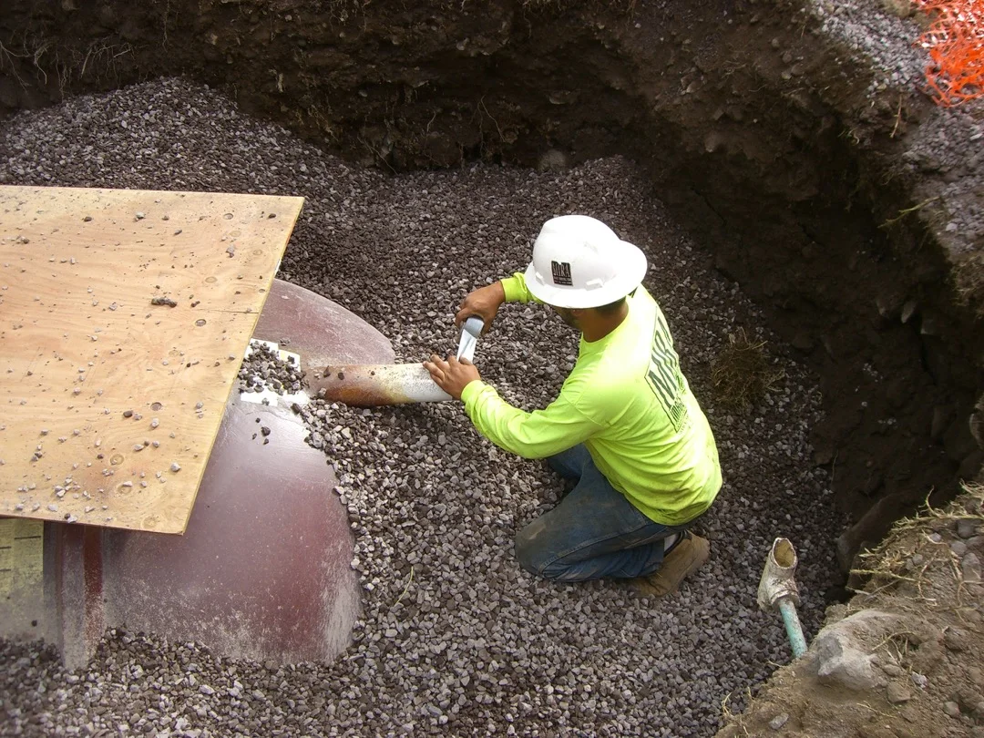 MIRA crew completing backfill at a new septic-system installation.