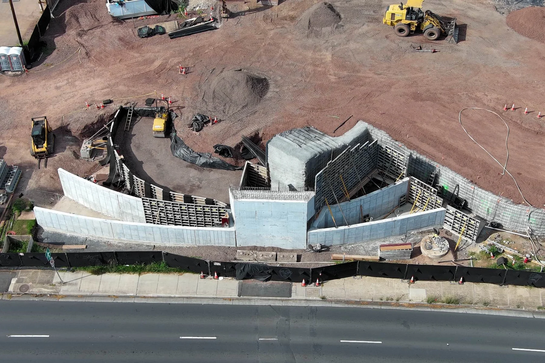 Aerial view of active construction on MIRA's Ala Moana Boulevard elevated pedestrian walkway project.